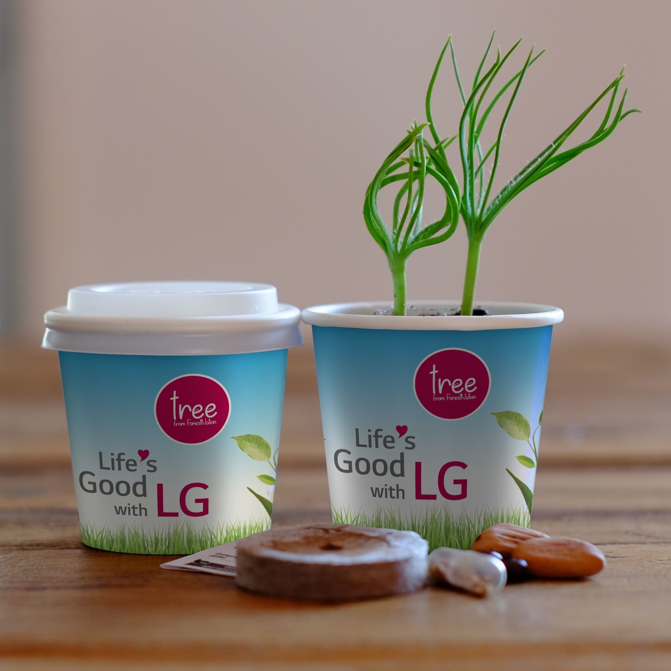 coffee cup with "life is good with LG" and a tree coming out of it