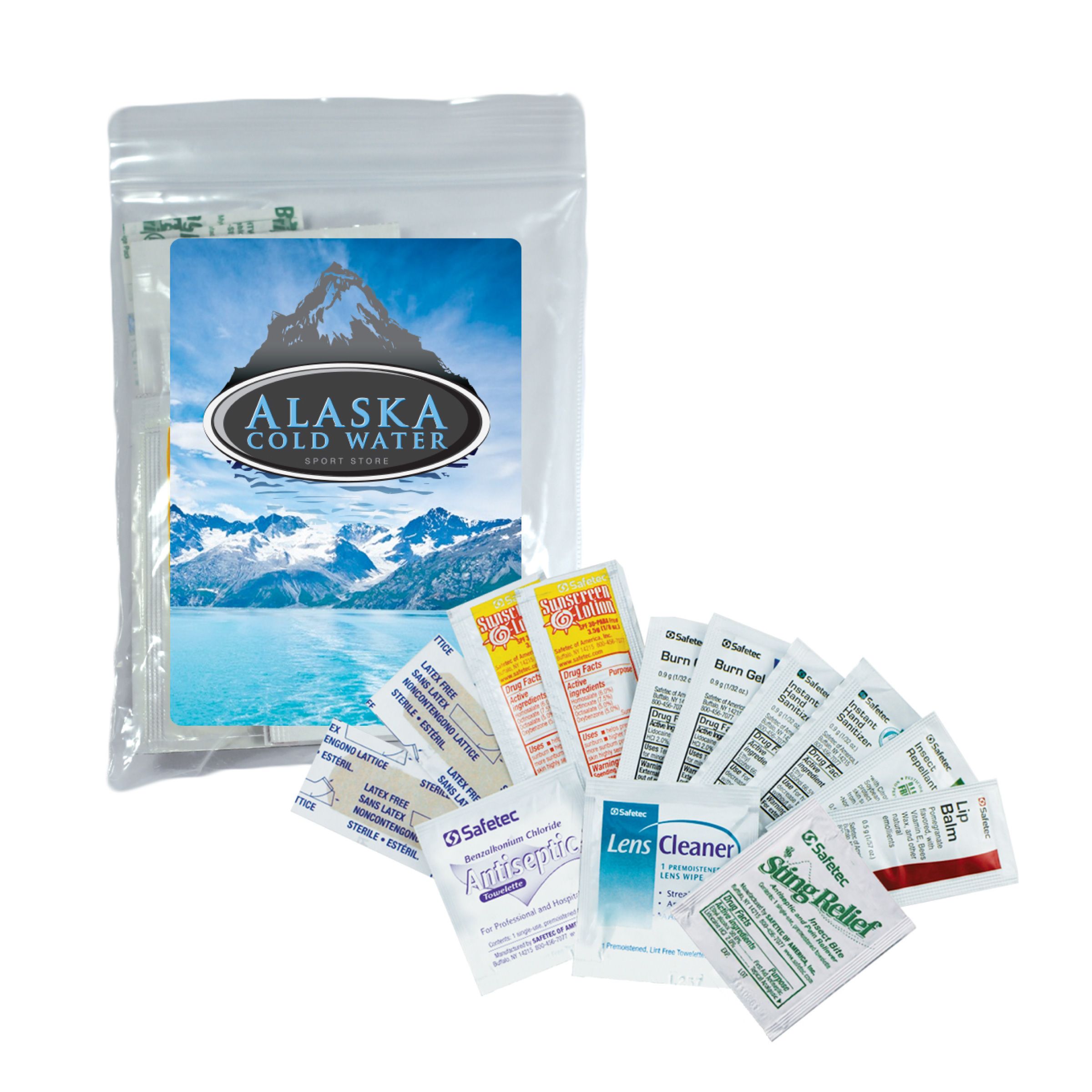 silver pouch with "alaska cold water" on the front with a photo of a mountain in front are various medical supplies